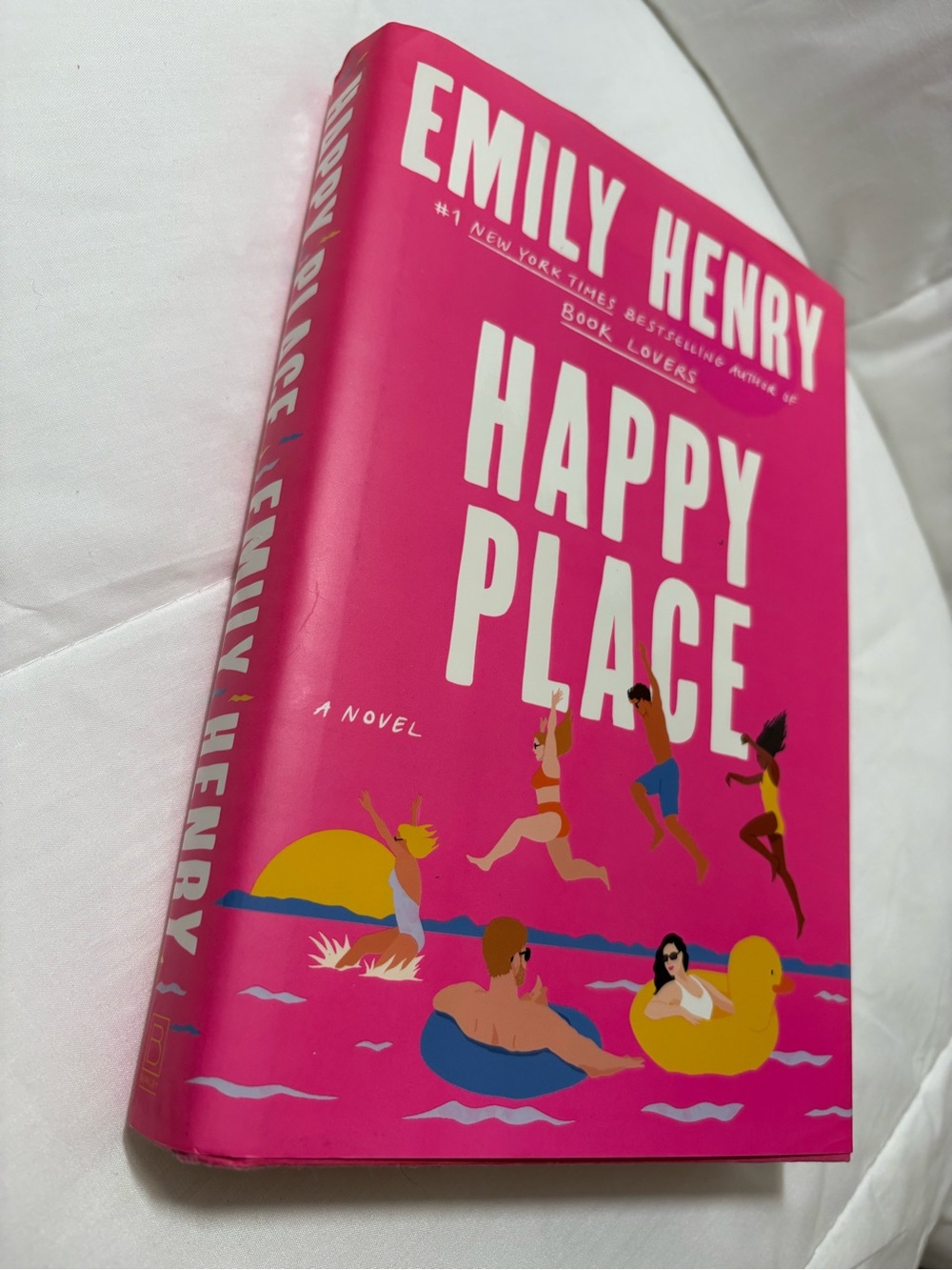 Happy Place Novel By- Emily Henry, Hardcover - Bright Pink Cover.